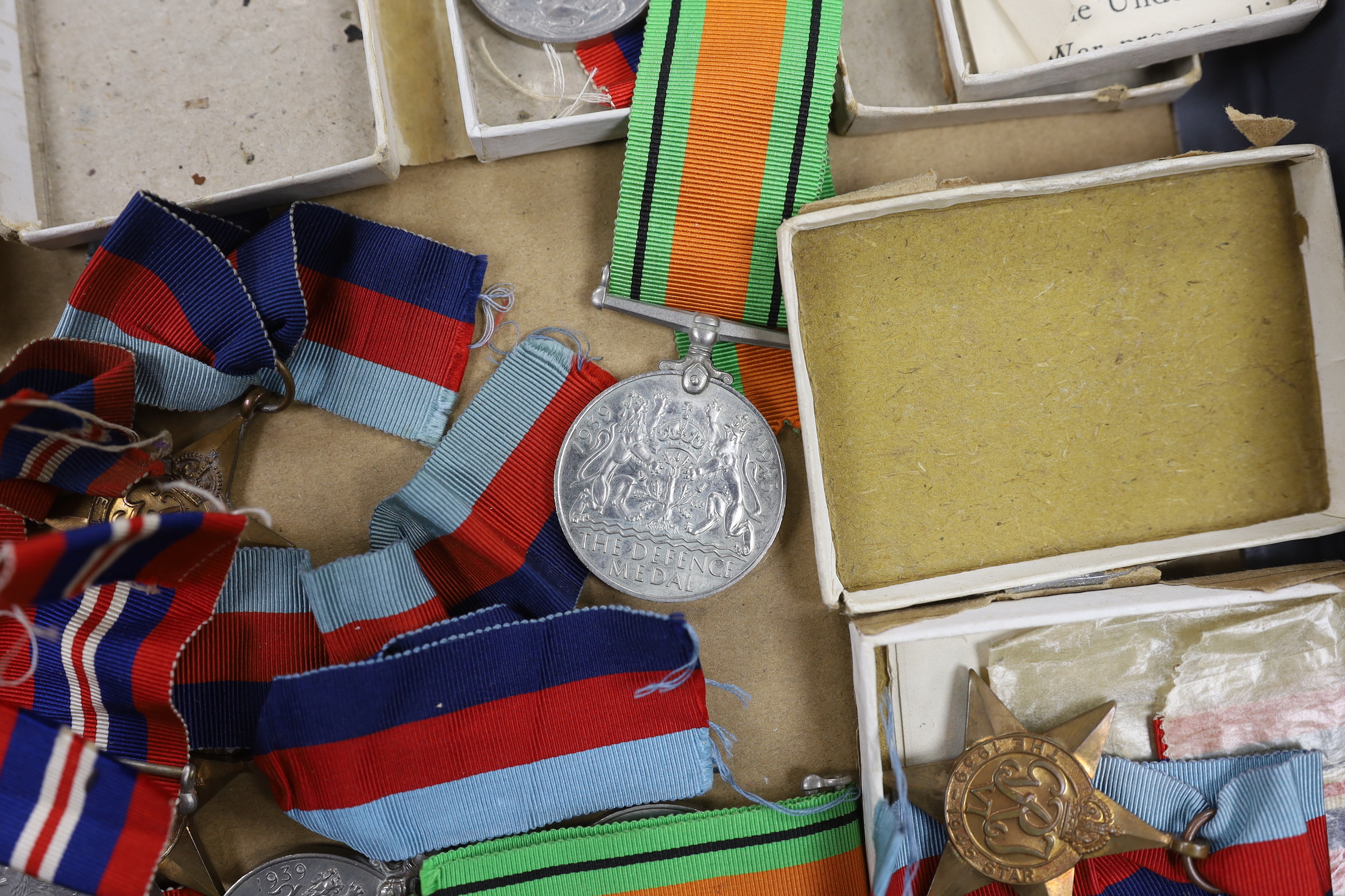 Fifteen WWII medals including some with original card boxes, including; eight War medals, three Defence medals and four 1939-1945 Stars